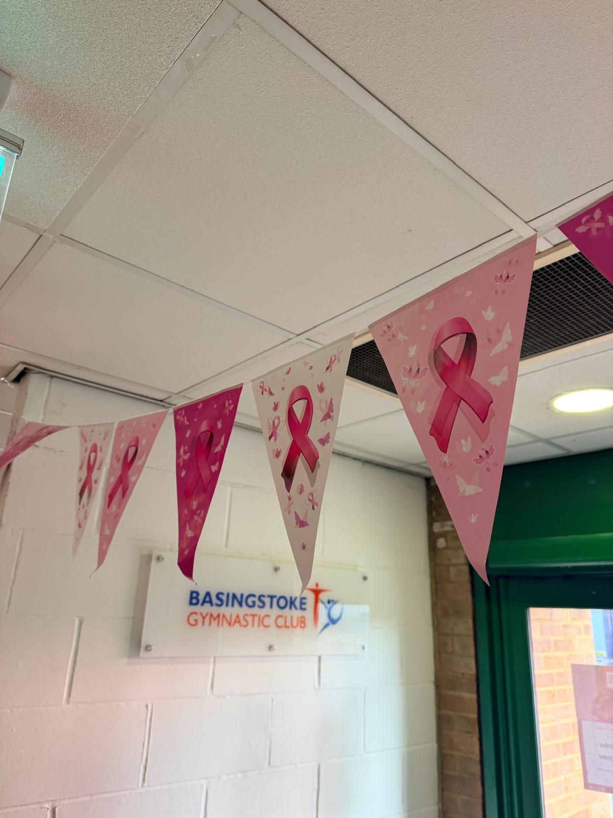 Breast cancer awareness bunting hanging inside Basingstoke Gymnastic Club.